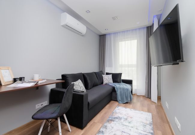 Ein Wohnzimmer in einer Wohnung für 4 Personen in der Powstańców-Straße!