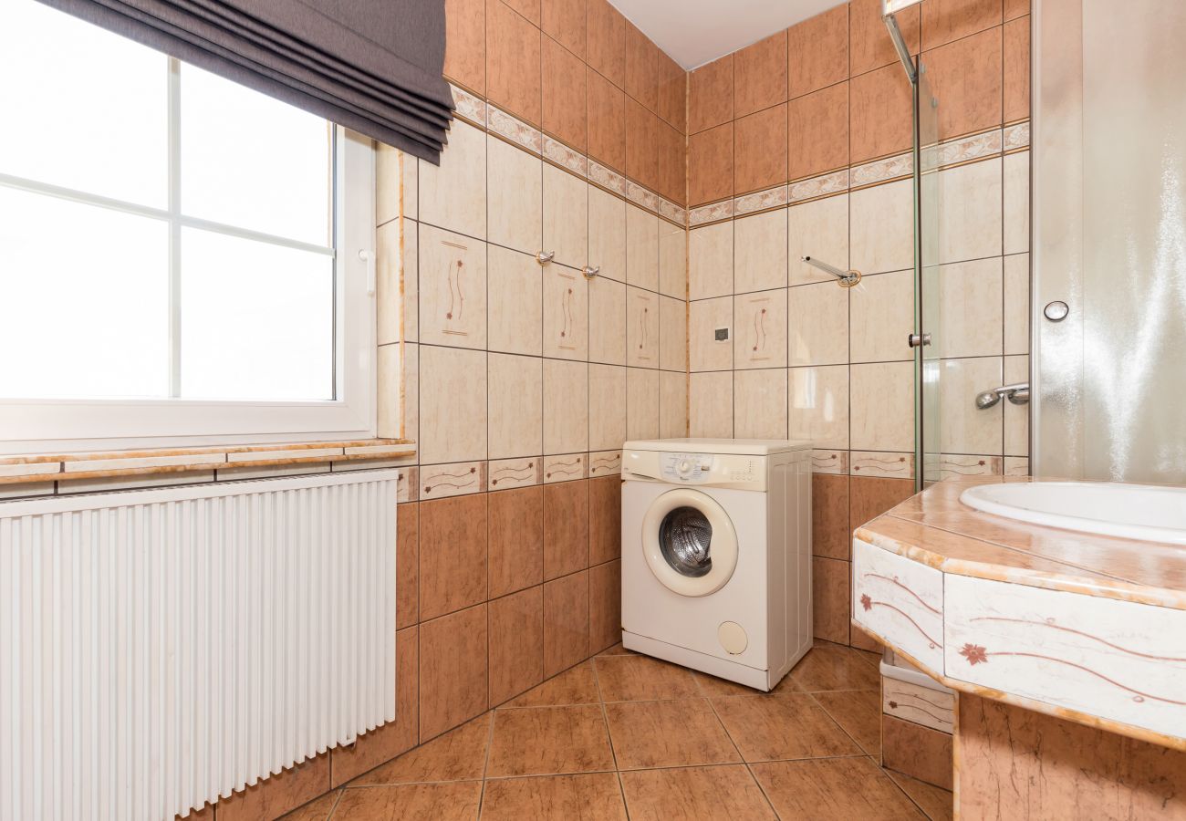 bathroom, radiator, washing machine, window, shower, washbasin