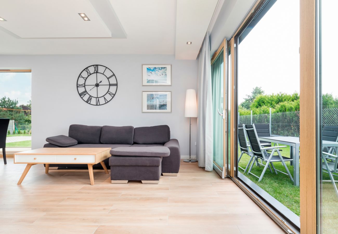 living room, clock, coffee table, sofa, window, outdoor view, rent