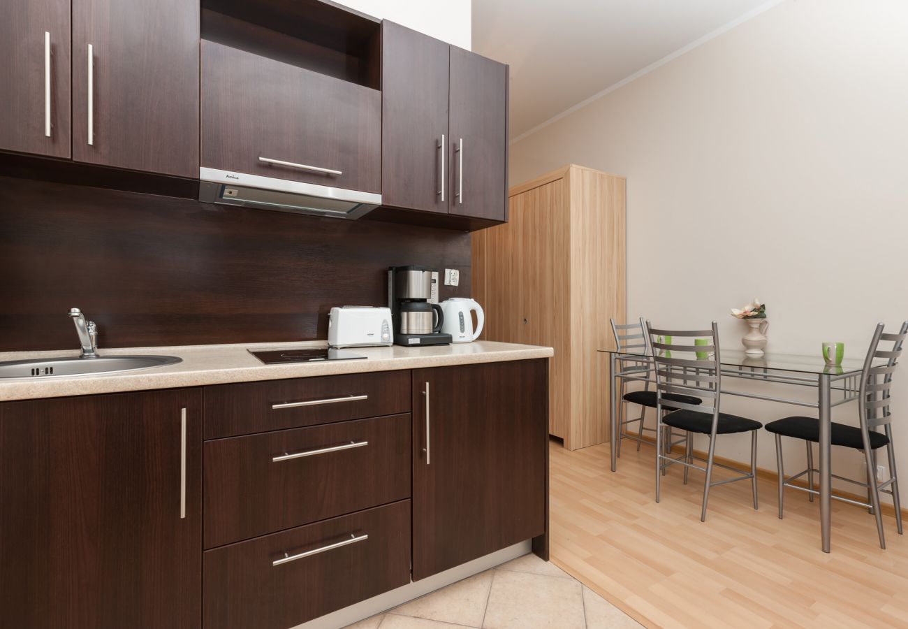 kitchenette, stove, toaster, kettle, coffee machine, dining area, dining table, chairs, wardrobe, rent