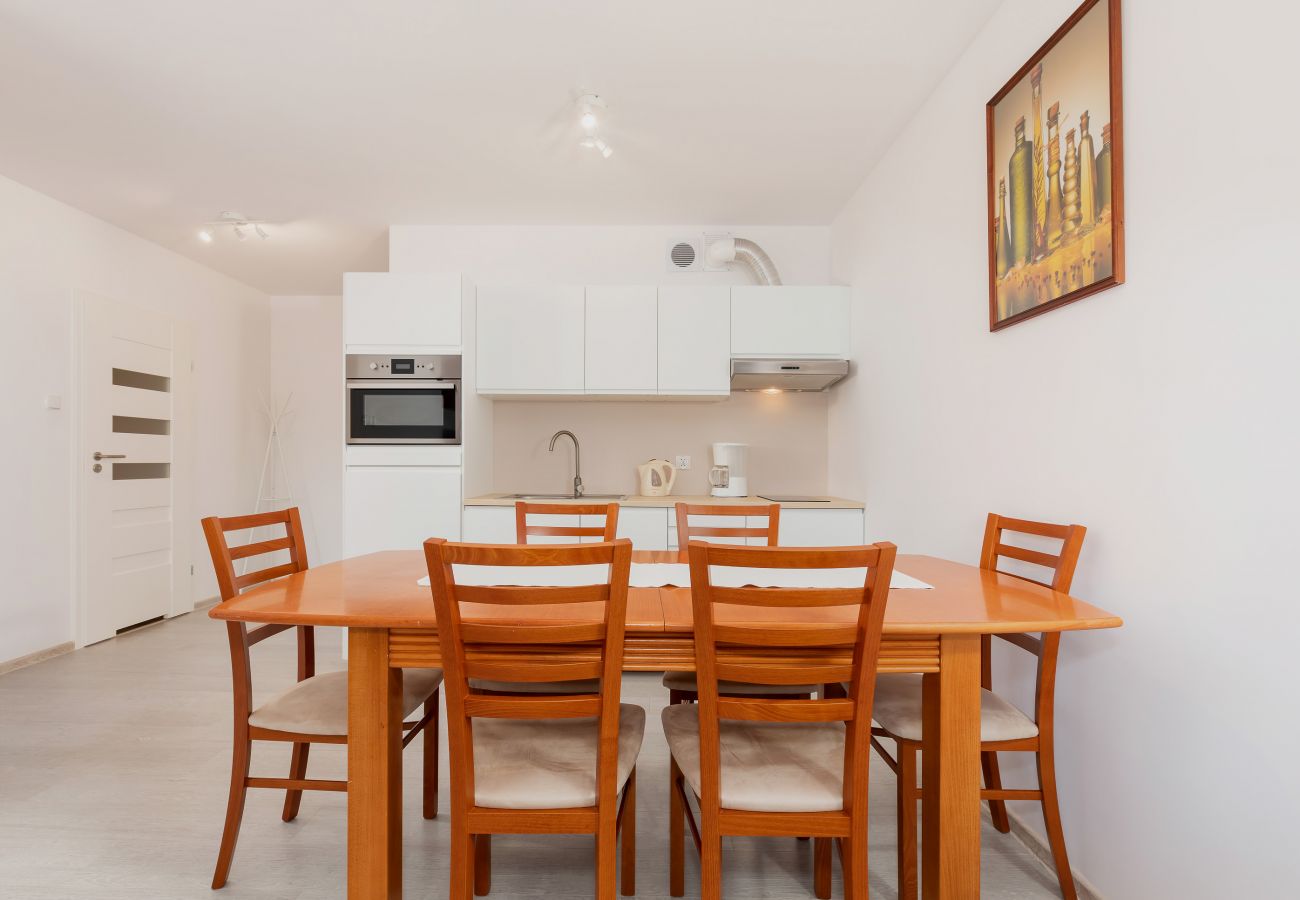 dining area, dining table, chairs, kitchenette, coffee machine, kettle, oven, sink, rent