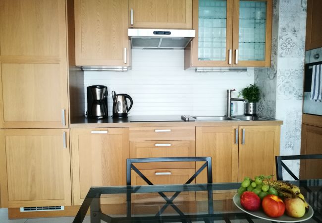 kitchen, kitchenette, coffee machine, kettle, stove, sink, cupboards, refrigerator, dining area, dining table, chairs, rent