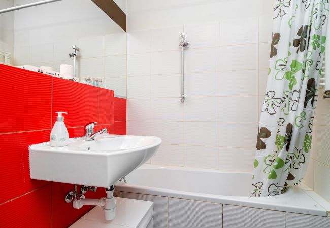 bathroom, bathtub, toilet, mirror, sink, washing machine, apartment interior, apartment, rent