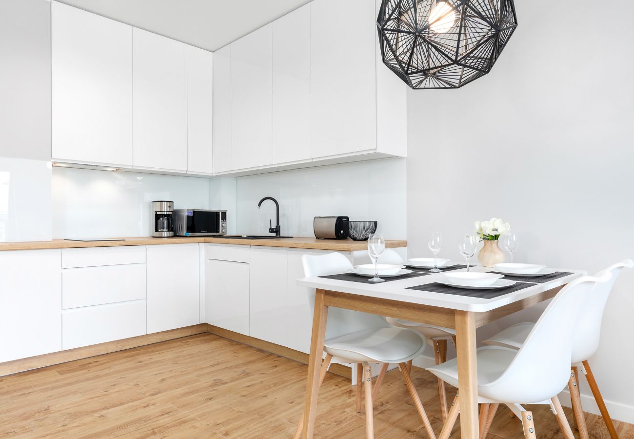 kitchen, kitchenette, dining area, dining table, chairs, kettle, coffee maker, toaster, microwave, dishwasher, fridge freezer, cupboards, apartment, i