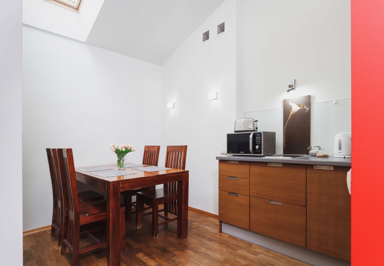 kitchen, kitchenette, fridge freezer, kettle, stove, microwave, coffee machine, toaster, cupboards, dining area, dining table, chairs, apartment, rent