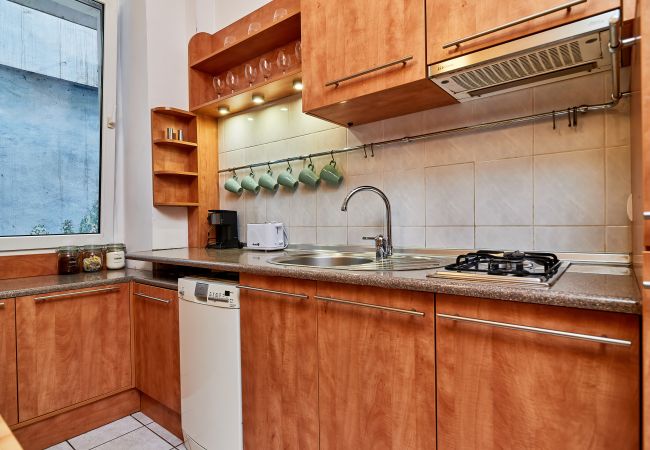 kitchen, stove, fridge freezer, microwave, kettle, coffee maker, toaster, cupboards, dining area, dining table, chairs, apartment, interior, rent