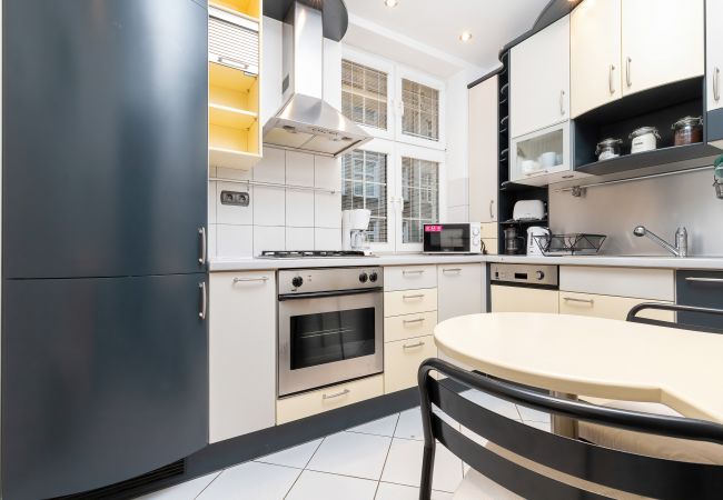 kitchen, fridge, kettle, gas stove, oven, microwave, dishwasher, coffee maker, toaster, cupboards, dining area, dining table, chairs, apartment, inter