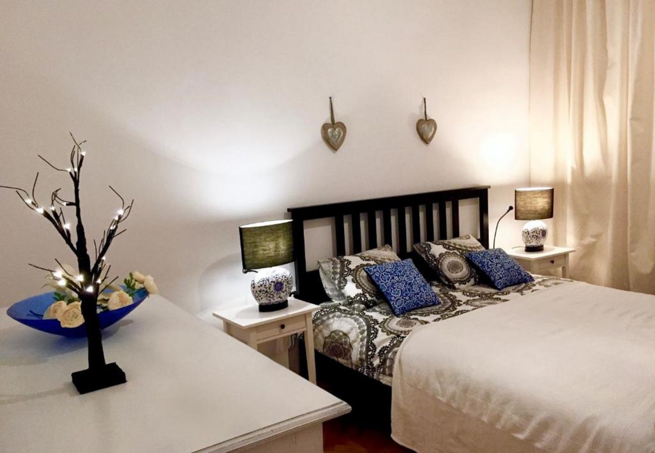 bedroom, double bed, nightstand, night lamp, TV, apartment, interior, rent