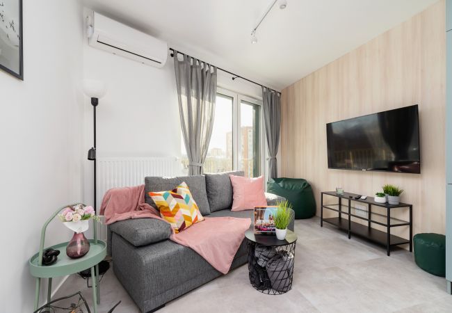 A spacious living room in a Premium apartment in Krakow at Świtezianka Street, close to the Tauron Arena.